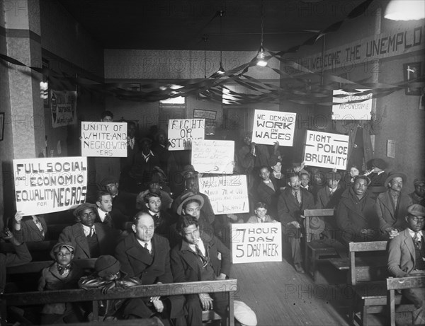 Labor protesters with signs: 'Full Social and Economic Equality for Negros