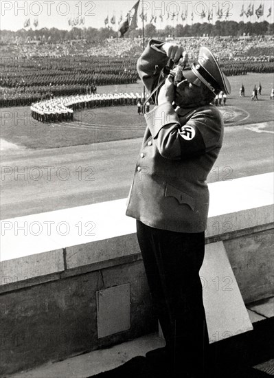 Nazi soldier with camera taking a photograph