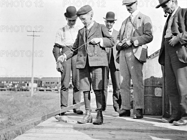 Four men [on a station platform?] at Warman