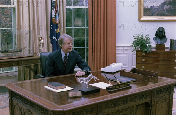 Jimmy Carter at his desk in the Oval Office