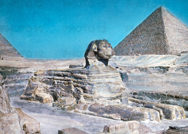 Original Caption:  Cairo and the pyramids