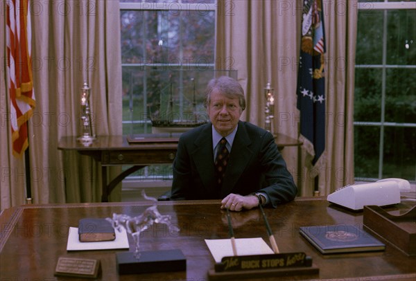 Jimmy Carter at his desk in the Oval Office