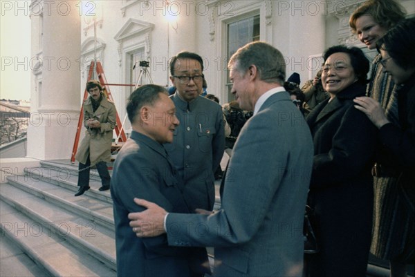 Deng Xiaoping and Madame Zhuo Lin say goodbye to Jimmy Carter and Rosalynn Carter.