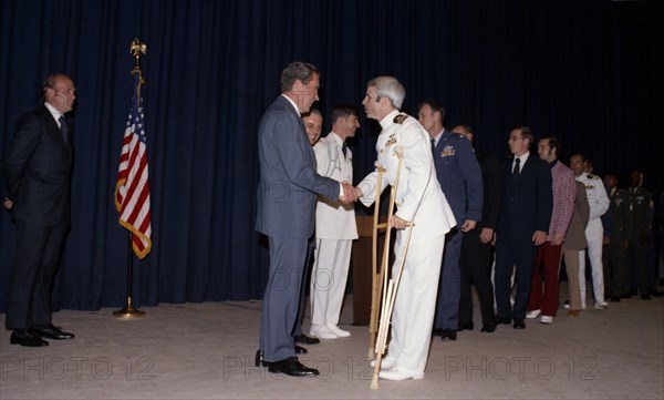 John McCain greeted by Richard Nixon.