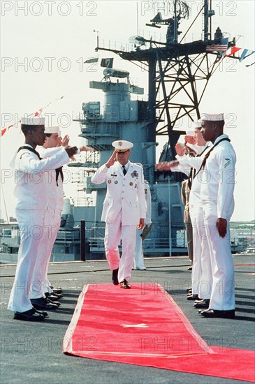 Sideboys salute as Gen. Colin L. Powell