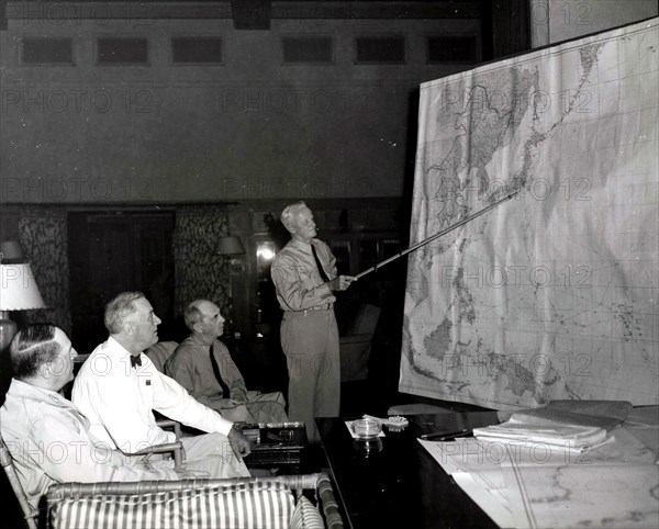 Admiral Chester Nimitz confers with President Roosevelt and officers