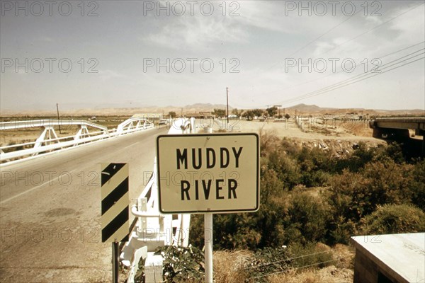 Muddy river and highway crossing