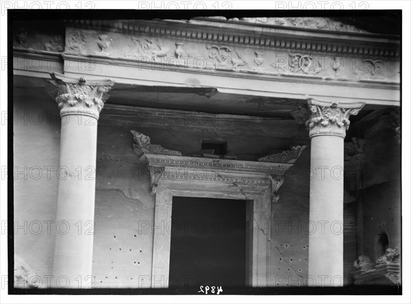Elaborate consoled cornice. Above lintel of main doorway in Petra, El-Khazneh ca. 1920