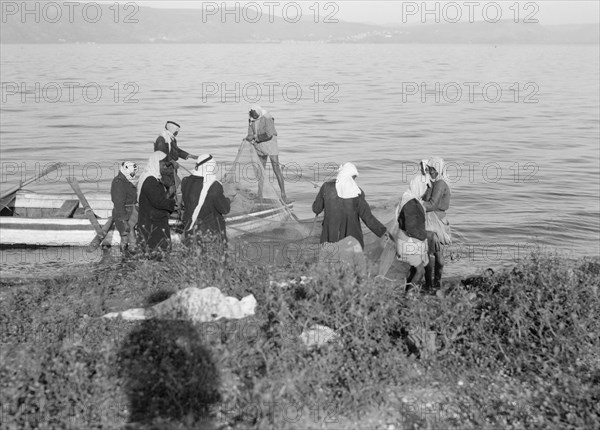 Arab fishermen working on their net on the east side of the Sea of Galilee ca. between 1934 and 1939