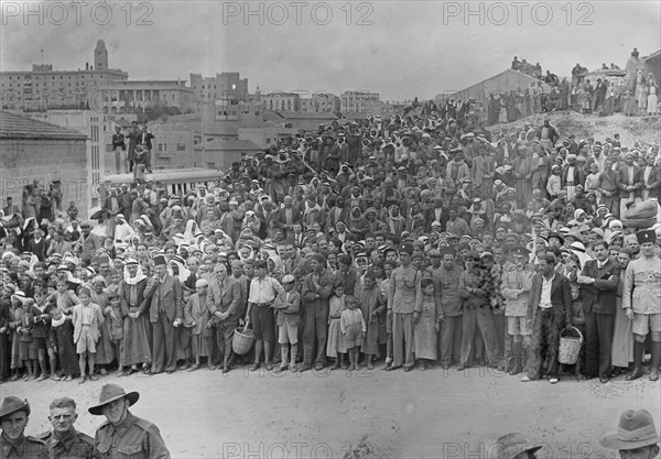 Arab recruits on parade in Jerusalem. Crowd of spectators. Arabs gathering watching parade ca. 1941