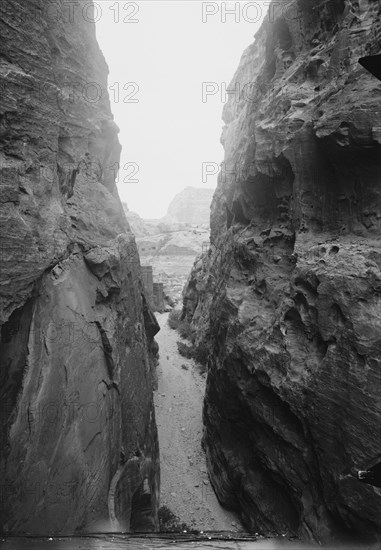 Petra in Transjordan. Sik between el-Khazne and the theatre ca. 1900