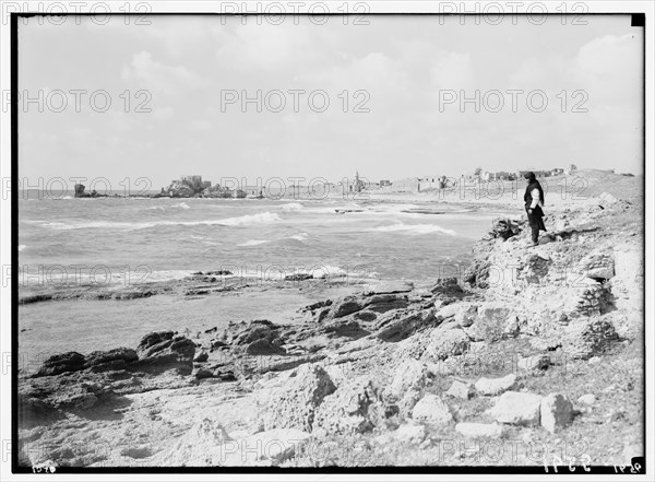 Man standing on shore looking out at the seat in Caesarea (Kaisarieh) ca. 1938