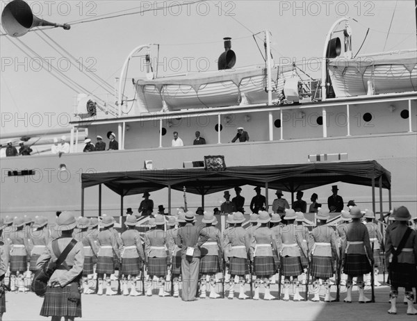 Ceremony of the opening of the Haifa harbour. His Excellency (possibly Sir Arthur Grenfell Wauchope) delivering the opening address to visitors and troops ca. 1933