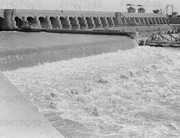 Hindiyah Barrage in Iraq, about 48 miles southeast of Baghdad. Foaming waters coming through the sluices ca. 1932