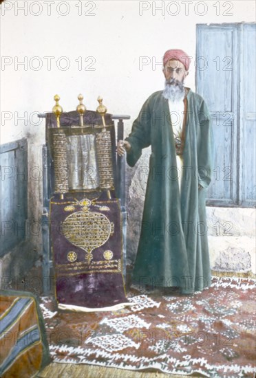 Color photo of a Samaritan High Priest and ancient scroll ca. between 1950 and 1977