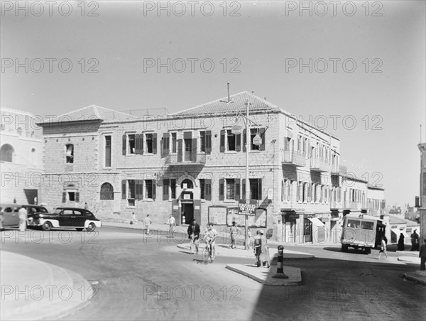 YMCA Hostel, old post office building, pedestrians and auto traffic in Jerusalem ca. between 1920 and 1946