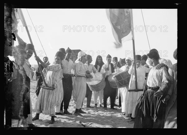 Men playing drums at Neby Rubin [i.e., Nebi Ruben], S. of Jaffa, Sept. 1930