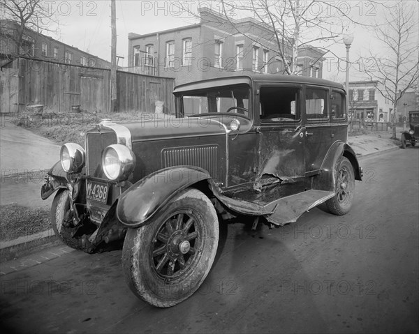 Close up of a car involved in an auto accident ca. early 20th century