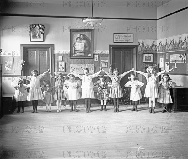 Young girls dancing or playing at William Lee's School, Georgetown, D.C.. ca. between 1910 and 1920