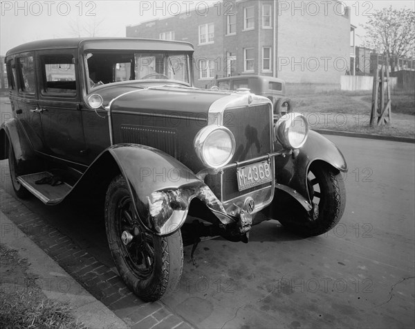Close up of a car involved in an auto accident, a fender bender ca. between 1910 and 1935