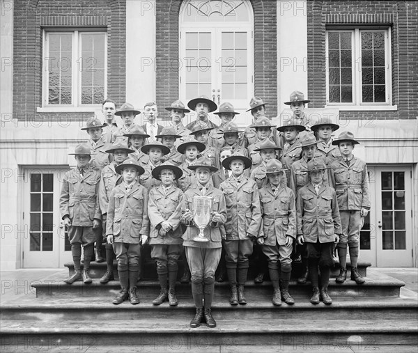 Boy Scouts group photo, standing with a trophy ca.  between 1910 and 1925