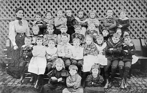 Miss Dyer school group, children group photo, arms crossed ca. between 1910 and 1935