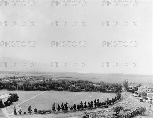 Sugar plantation in Hawaii. Showing shipping port in distance ca.  between 1910 and 1920