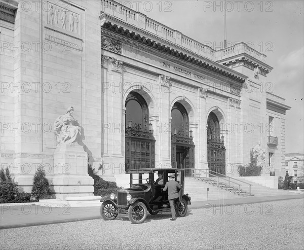 Man stepping inside an automobile from the Ford Motor Company ca.  between 1910 and 1926