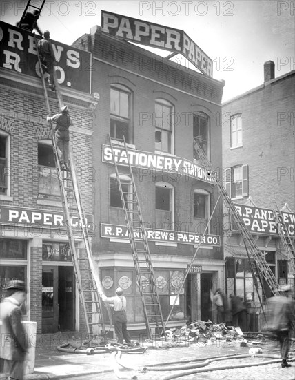 Firefighters in the aftermath at the R.P. Andrews paper company fire ca.  between 1910 and 1925