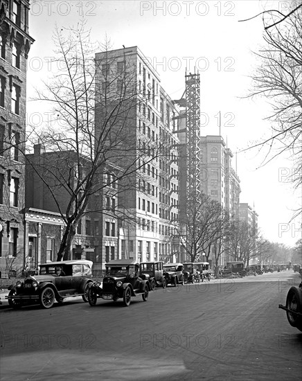 Car driving down a street in Washington, D.C. ca.  between 1910 and 1920