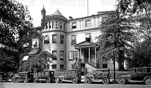 Cars parked outside the National League of Women Voters office ca.  between 1910 and 1926
