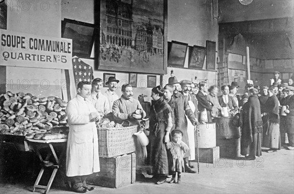 Giving out the day's rations of food to refugees in Belgium. ca. between 1910 and 1920
