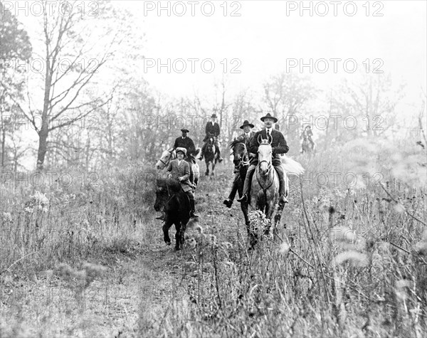 Men and boy on horses during hunt in Virginia ca. 1910