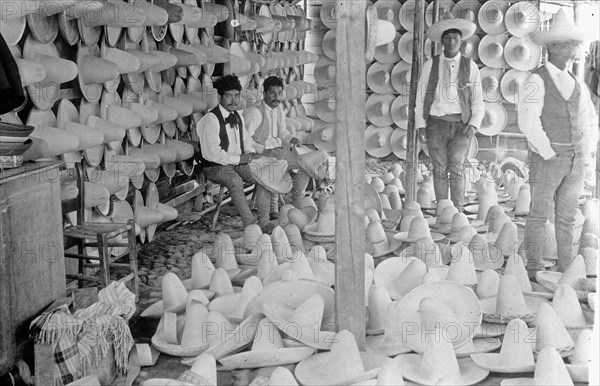 Men selling MexiCompany Sombreros in Market place, Mexico City ca.  between 1909 and 1920