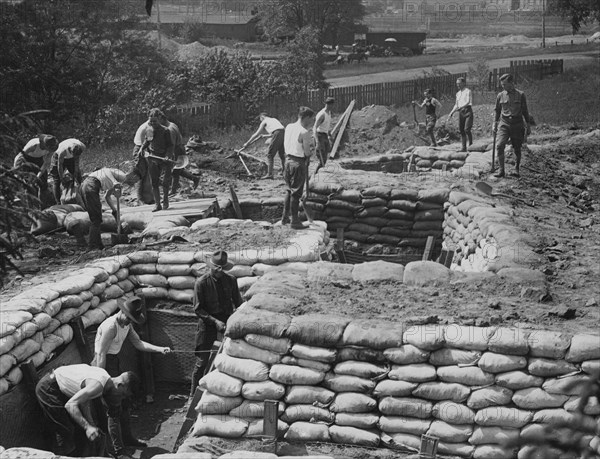 The students of Princeton University, who have enrolled for military service in France, are learning the trade of war in a practical way, building trenches ca.  between 1914 and 1918