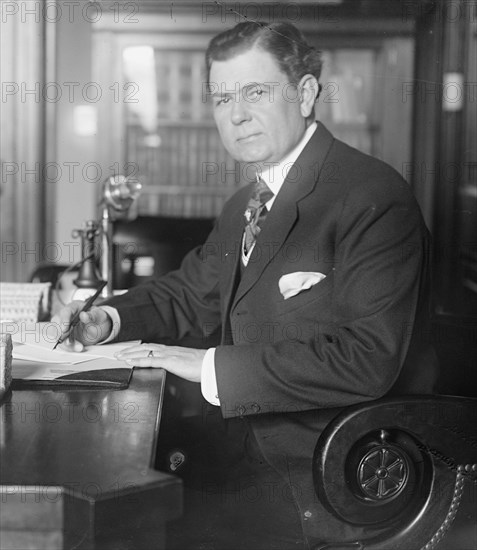 Senator Park Trammell of Florida sitting at his desk ca. between 1909 and 1920