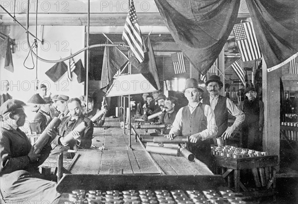 Men inspecting cartridge cases  ca. between 1909 and 1920