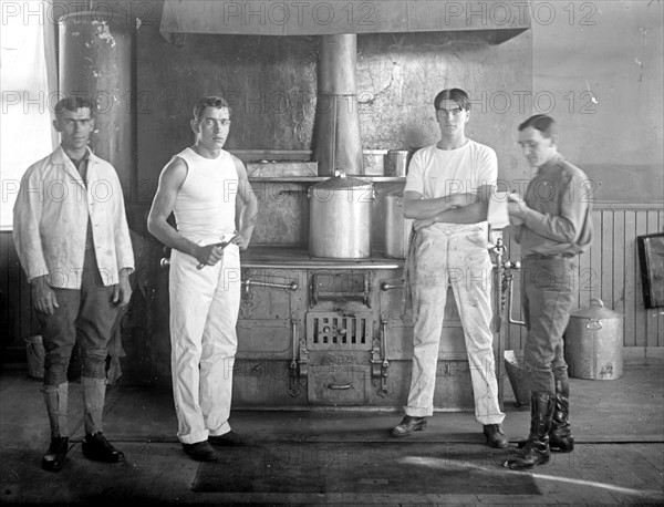 U.S. Army cooks in a kitchen ca. between 1909 and 1940