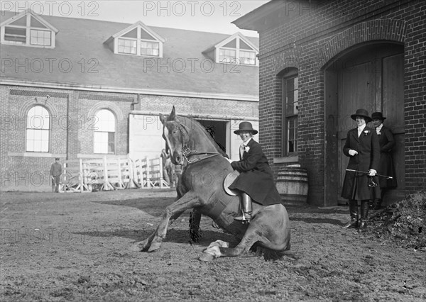 Helen Buchanan atop a sitting horse ca. between 1909 and 1919