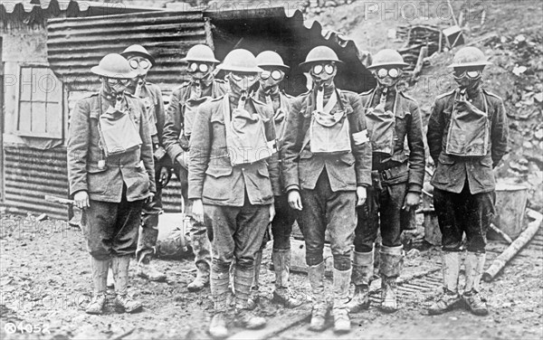 Soldiers wearing gas masks ca. between 1909 and 1920