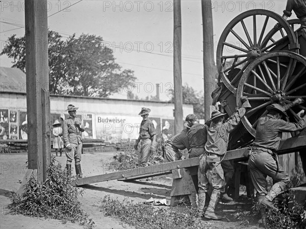 U.S. Army, transportation of equipment & troops, loading or unloading equipment ca. between 1909 and 1940