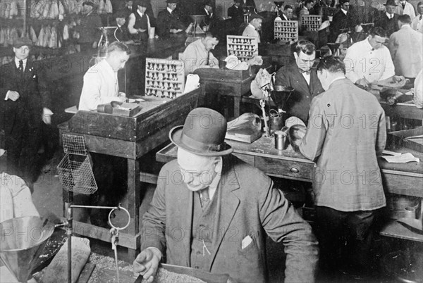 Agricultural Department grading samples in grain inspecting Office ca. between 1909 and 1920