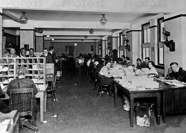 Women putting checks in envelopes in the Veterans Bureau, Washington, D.C ca. between 1909 and 1932