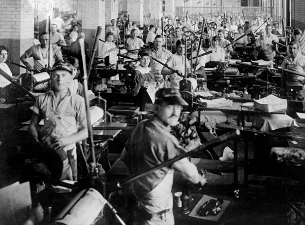 Employees at their workstations at the Bureau of Engraving and Printing ca. between 1909 and 1932