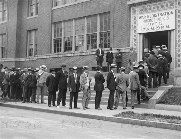Line of men signing up for draft registration ca.  between 1918 and 1920