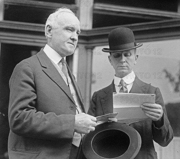 Pat Crowe & Earl Dudding, a man reading a document ca.  between 1918 and 1920