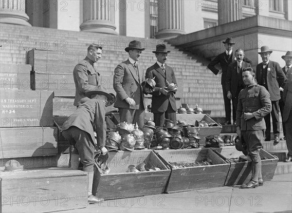 Men unloading helmets for victory loan ca. between 1918 and 1920