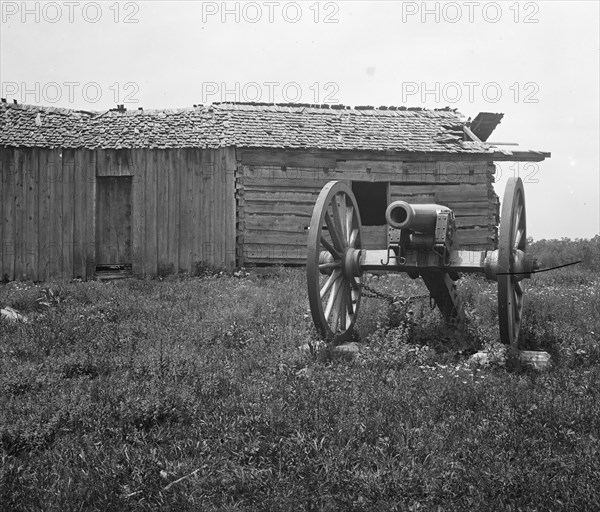 Cannon and cabin at Chickamauga and Chattanooga National Military Park ca.  between 1918 and 1920