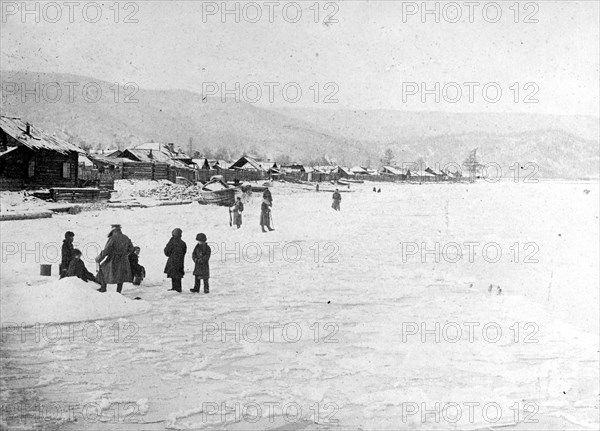 People on the shores of frozen Lake Backel, Czechoslovakia ca.  between 1918 and 1921