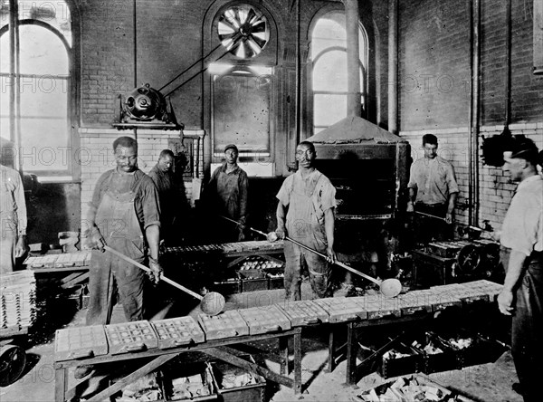 Men pouring melted metal into molds in the Government Printing Office, Washington, D.C. ca. [between 1909 and 1932]